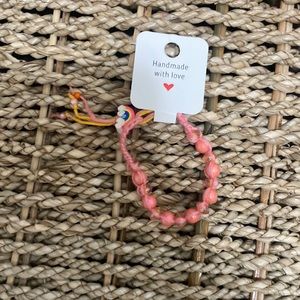 Selling a pink bracelet, kid size